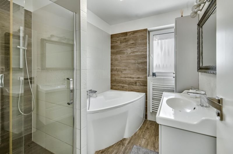 Bathroom with shower and bathtub